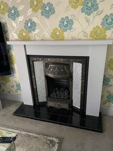 Cast iron fireplace and wooden
